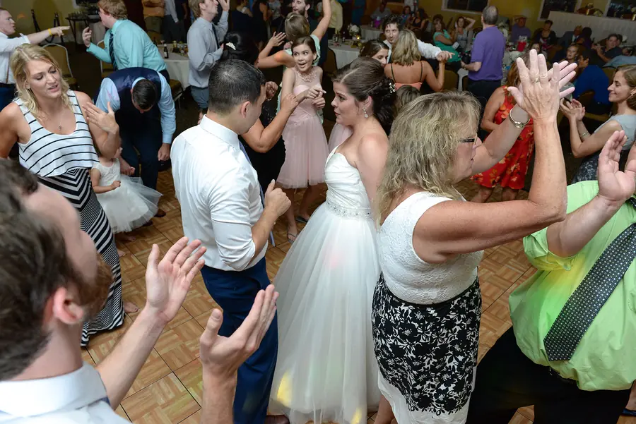 Wedding guests celebrating on the dance floor